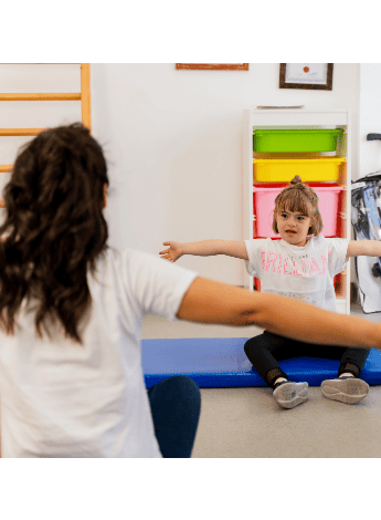 Physio working with a child with a disability 